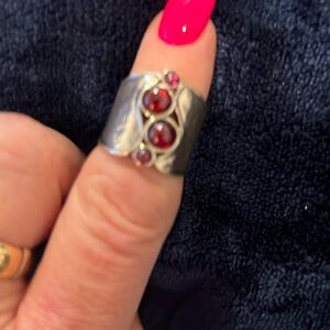 Silpada sterling ring with garnet stones.